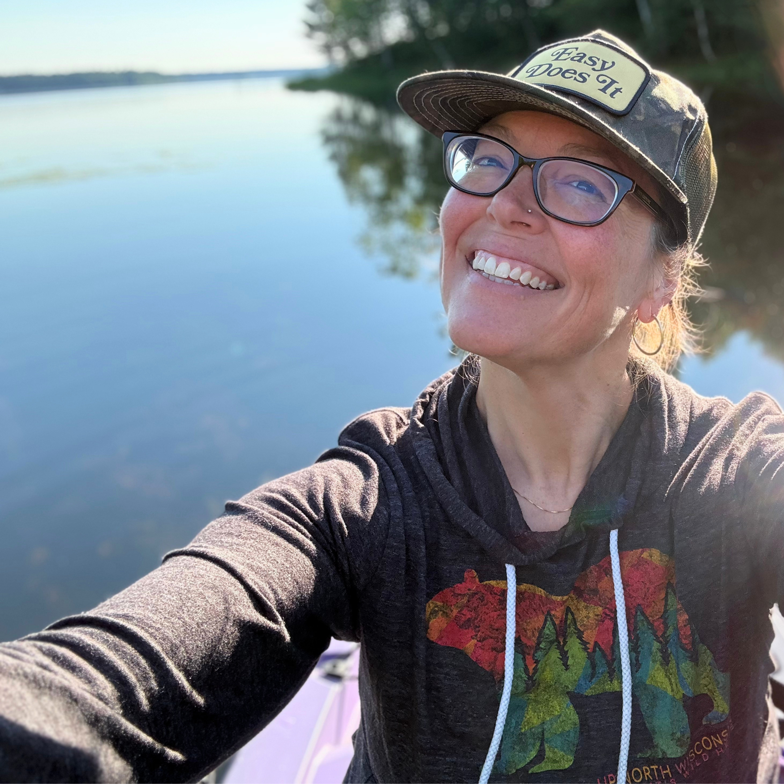 Heather Harti smiling outdoors by the water